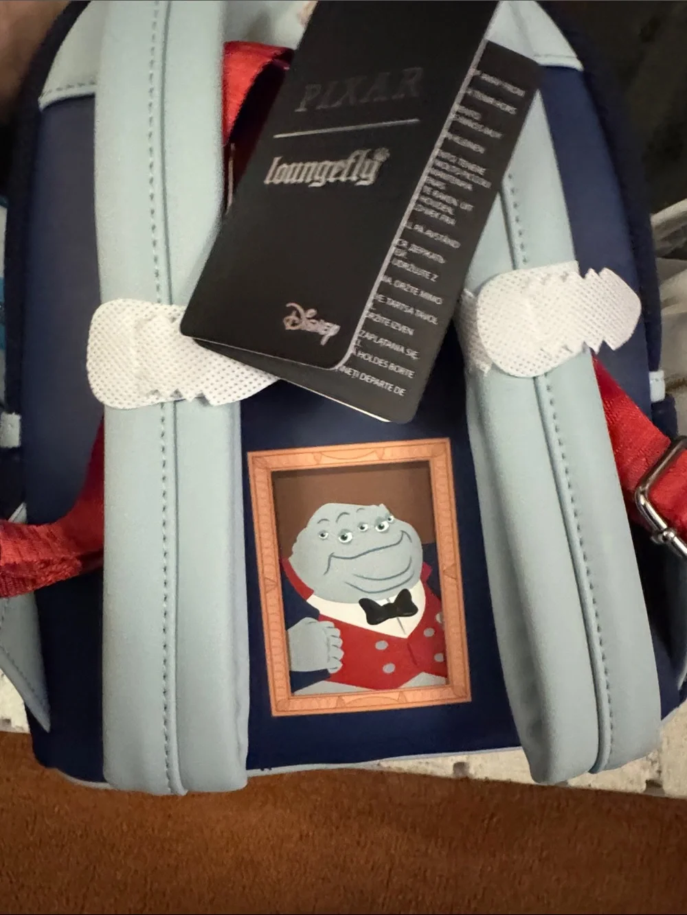 Loungefly Light Blue Multi‑Eye Monster Crossbody with Red Vest and Black Bow